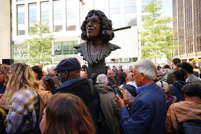 People at the unveiling of the statue of Betty Campbell, Wales’ first black headteacher (Ben Birchall/PA)