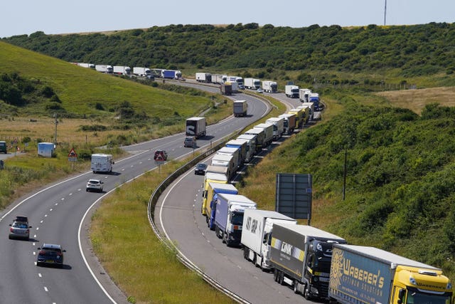 Lorry drivers queue along the A20 in high temperatures, waiting to enter the Port of Dover in Kent 