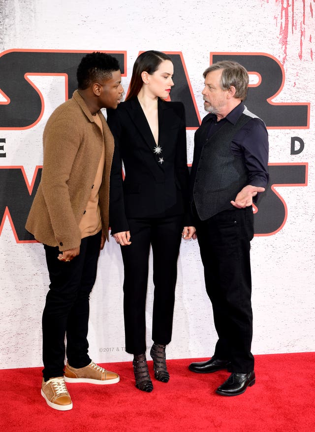 John Boyega and Daisy Ridley with Mark Hamill (Ian West/PA)