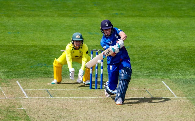 Nat Sciver-Brunt hits out during her century as wicketkeeper Alyssa Healy looks on