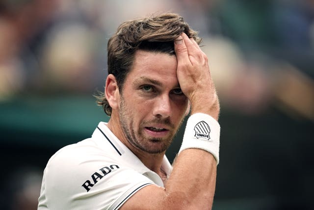 Cameron Norrie puts his hand on his head