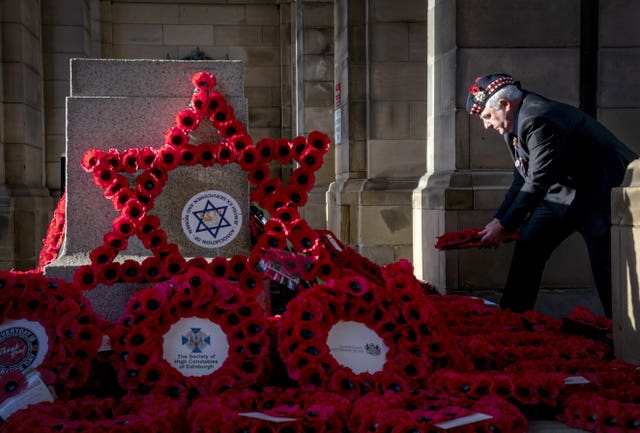 Wreaths are laid at the Stone of Remembrance