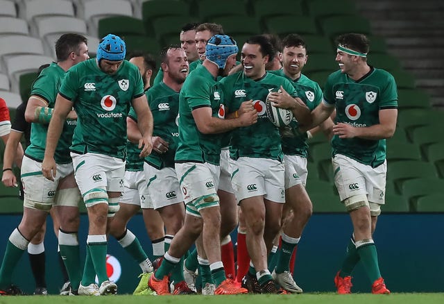 New Zealand-born James Lowe, with ball, celebrates his late try against Wales