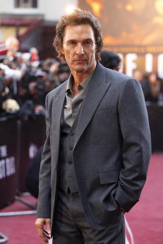 Matthew McConaughey posing for photos at a red carpet event