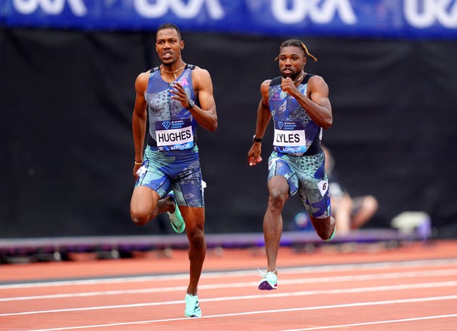 British sprinter Zharnel Hughes races ahead of American Noah Lyles on a clay-coloured track 