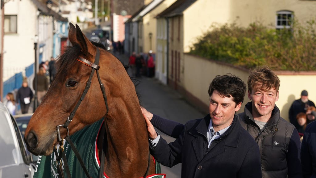 Trainer Emmet Mullins poses with Noble Yeats outside the Lord Bagenal Inn during their homecoming parade in County Carlow