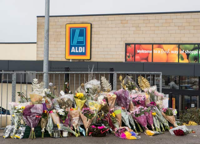 Floral tributes outside an Aldi supermarket in Skipton where Jodie Willsher was stabbed to death (Danny Lawson/PA)