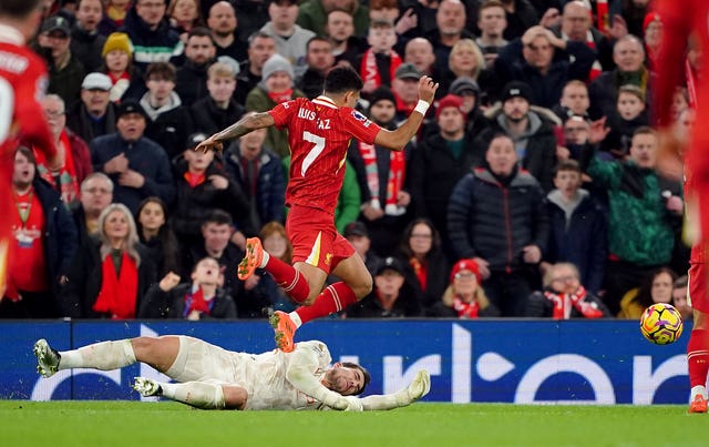 Manchester City goalkeeper Stefan Ortega brings down Liverpool’s Luis Diaz to concede a penalty