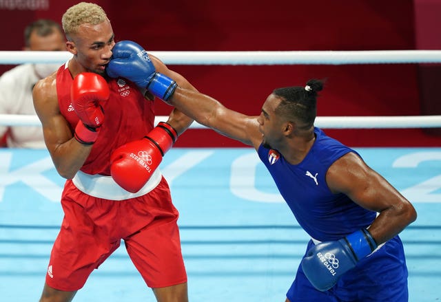 Cuba’s Arlen Lopez, right, is now a two-time Olympic champion (Mike Egerton/PA)