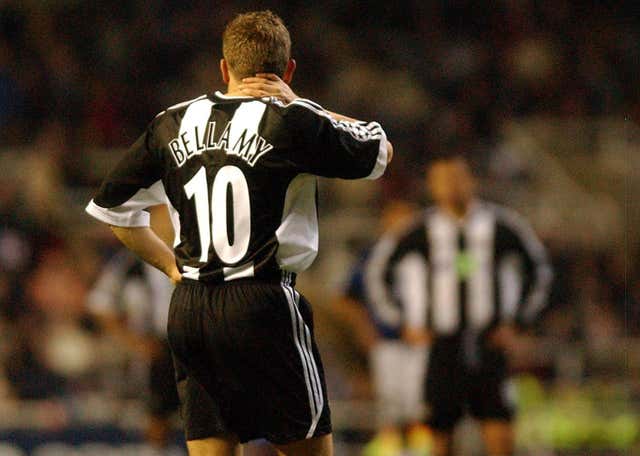 Dejected Newcastle striker Craig Bellamy leaves the field after being sent off against Inter Milan