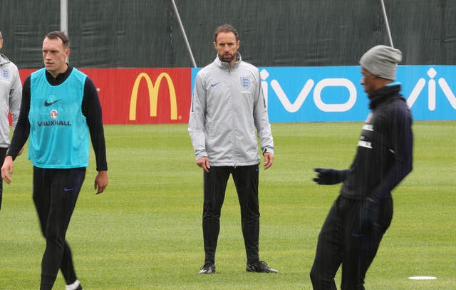 Gareth Southgate, centre, watches England training on Wednesday