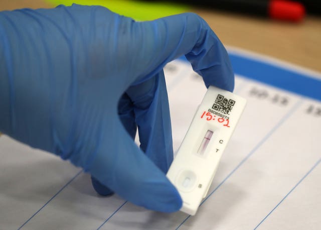 People carry out asymptomatic testing  (Andrew Milligan/PA)