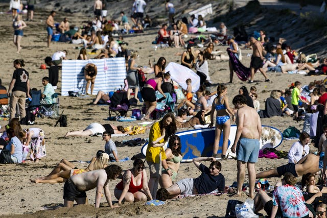 Beachgoers enjoying the warm weather