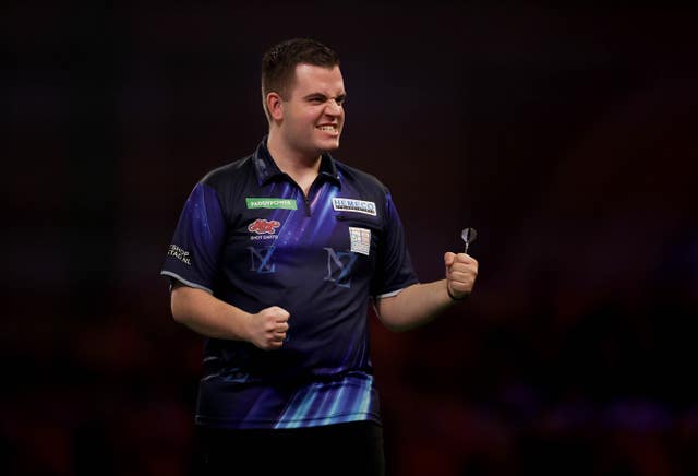 Niels Zonneveld reacts after winning a set during his match against Jonny Clayton at the World Darts Championship