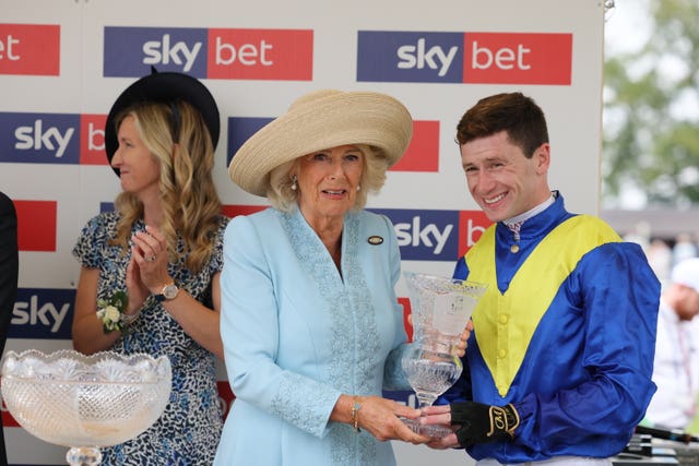 The Queen presents the trophy to Oisin Murphy after Never So Brave's York success 