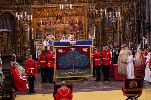 Queen Camilla (right) watches as King Charles III is behind an anointing screen during their coronation ceremony, with researchers claiming the screen was made a perfect cube inside the square of the pavement following an explanation about the meaning of the pavement. (PA Archive)