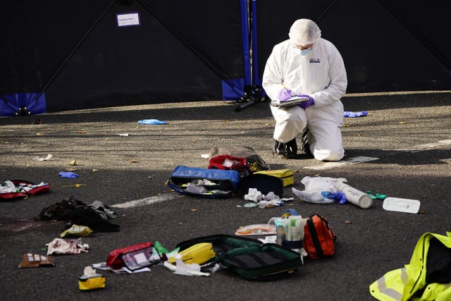A forensic officer at work (Aaron Chown/PA)