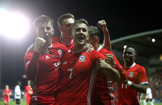 Ben Woodburn, left, scored the only goal as Wales won without Gareth Bale