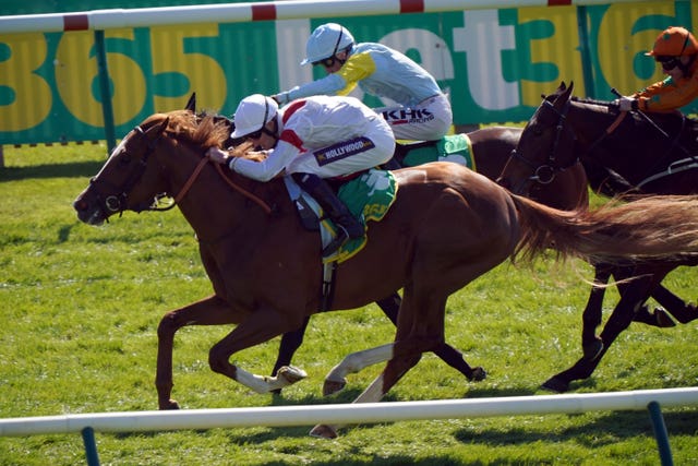 Canberra Legend ridden by jockey Daniel Muscutt on their way to winning the bet365 Feilden Stakes at Newmarket 