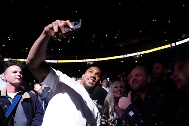 Anthony Joshua takes selfies with the fans at The O2, 