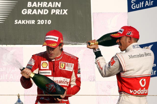 Lewis Hamilton (right) with Fernando Alonso after the Spaniard won the 2017 Bahrain Grand Prix
