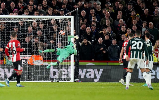 Diogo Dalot (right) curls home Manchester United's winner