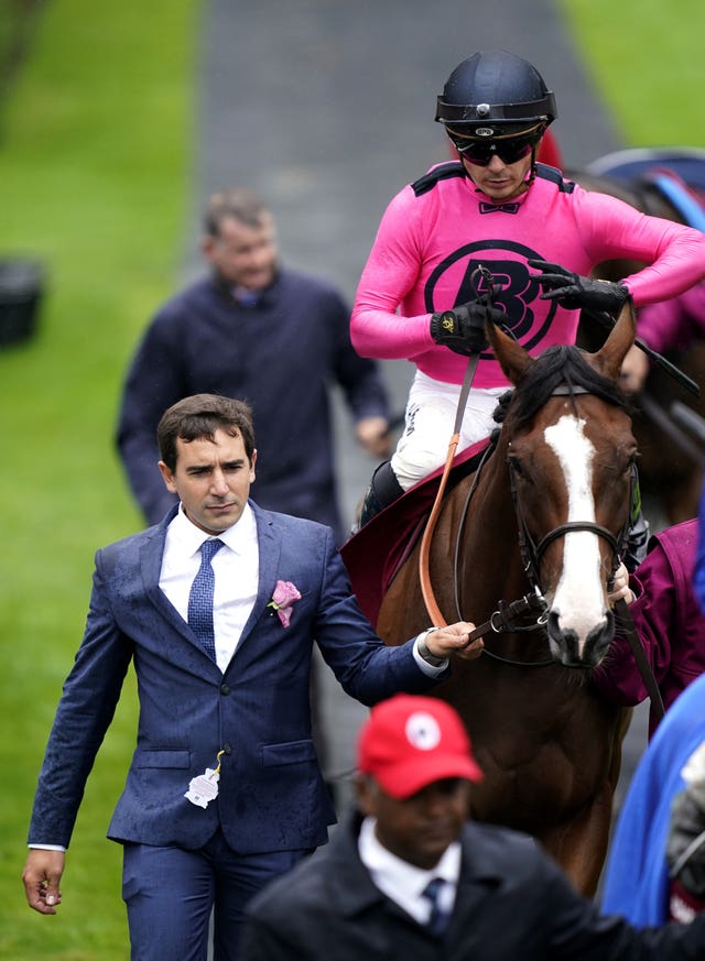 Jerome Reynier leads Facteur Cheval out ahead of the Qatar Sussex Stakes