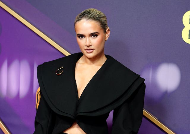 Molly-Mae Hague in a black dress at a red carpet event