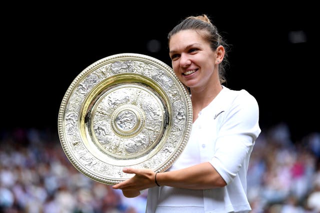 Simona Halep holds the Wimbledon trophy