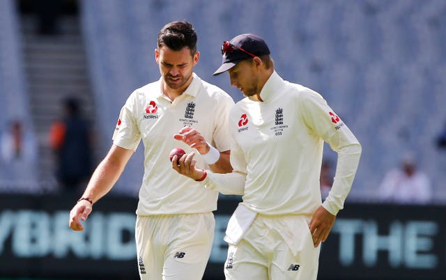 England’s James Anderson and Joe Root inspect the ball during day five of the Ashes Test (Jason O'Brien/PA)
