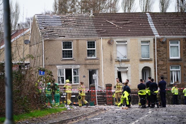 Emergency personnel at the scene after reports of a suspected gas explosion at a property on the junction of Clydach Road and Field Close in Morriston, Swansea 