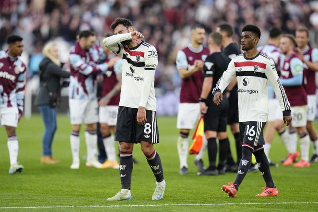 Manchester United’s Bruno Fernandes, left, and Amad Diallo react to defeat at West Ham