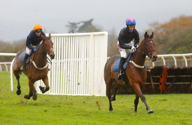 Harry Cobden and Cue Card (right) during a recent racecourse gallop at Wincanton