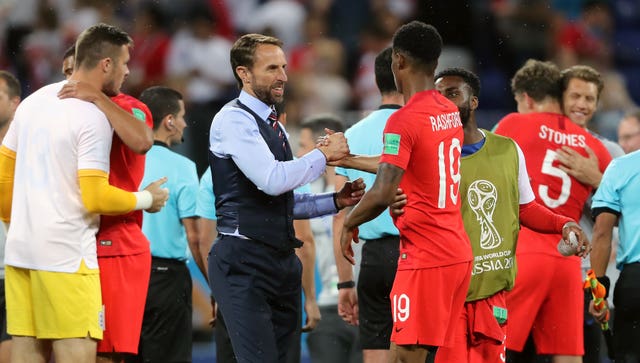 England boss Gareth Southgate, centre, and Marcus Rashford embrace at the end of Monday's match