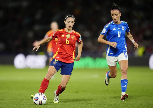 Spain’s Aitana Bonmati (left) battles for the ball with Italy’s Barbara Bonansea (right) at Euro 2025