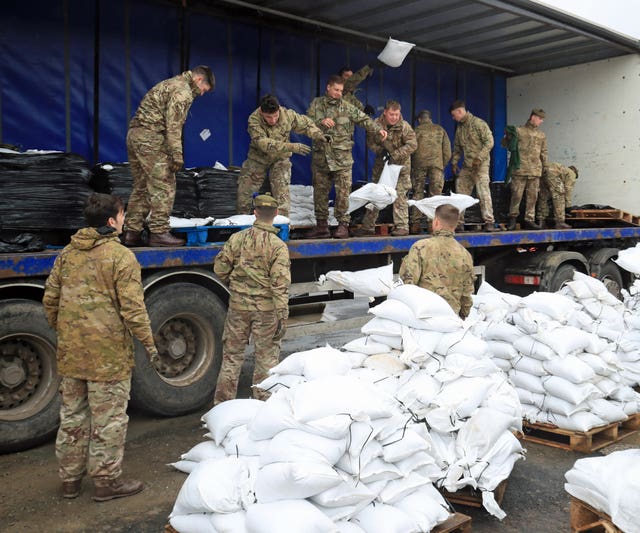 Soldiers help with the flood relief effort in Mytholmroyd