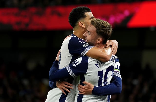 James Maddison, right, celebrates his second goal with Tottenham team-mate Dominic Solanke