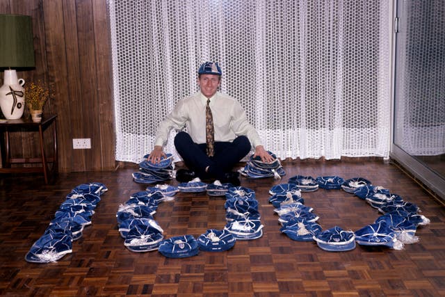 Charlton with his England caps at the time he won his 100th (PA).