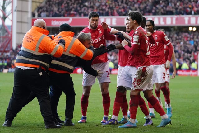 Cameron Toner was restrained by stewards after attacking three Forest players during the match (Tim Goode/PA)