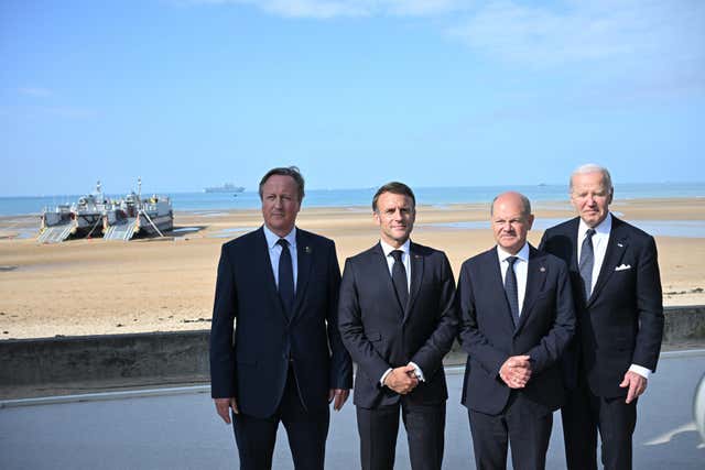 Foreign Secretary Lord David Cameron with French President Emmanuel Macron, German Chancellor Olaf Scholz and US President Joe Biden at D-Day commemorations in France in 2024