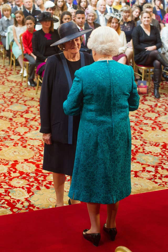 Dame Maggie Smith with the late Queen Elizabeth II