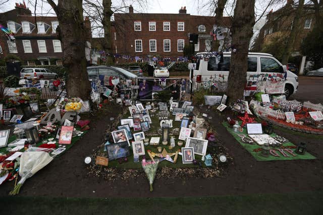 Tributes outside George Michael's home in London on the one-year anniversary of his death (Jonathan Brady/PA)