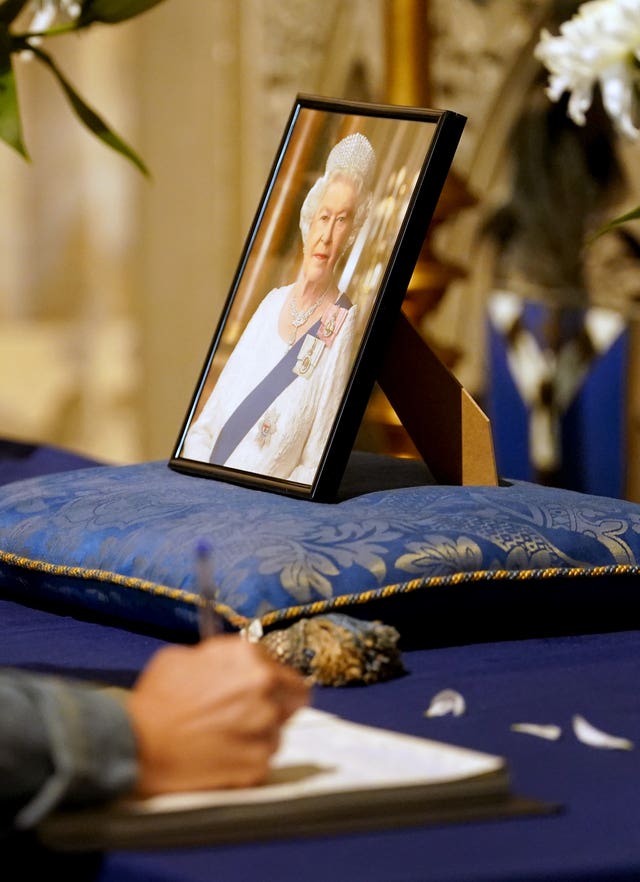 Mourners sign the book condolence at Canterbury Cathedral in Kent