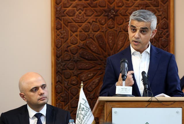 Mayor of London Sadiq Khan, right, is watched by Home Secretary Sajid Javid at an Acting in Solidarity event held at a mosque in north London