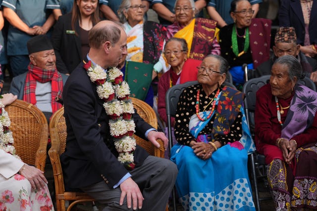 The Duke of Edinburgh sits with elderly Gurkha veterans and widows 