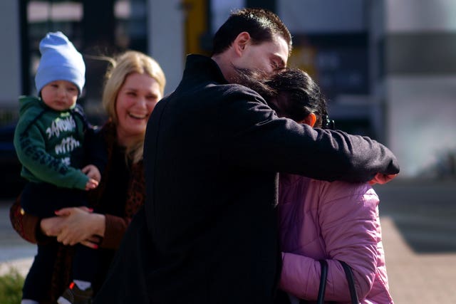 Ukrainian-born Vasyl Kucherka hugs his mother Olha Kucherka