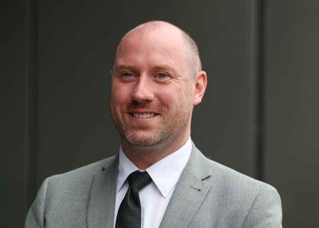 Health Secretary Neil Gray smiles at the camera