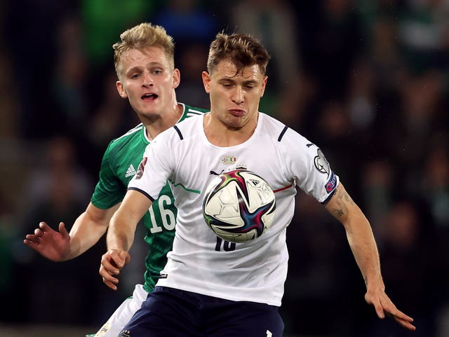 Northern Ireland’s Alistair McCann (left) and Italy’s Nicolo Barella battle for the ball 