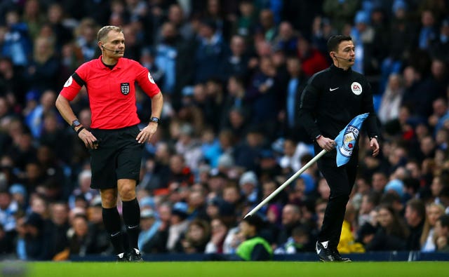 Referee Graham Scott (left)