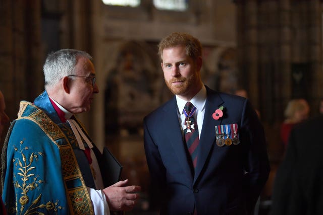 Harry, pictured with the Dean of Westminster, at the Anzac day service attended the event last year. Victoria Jones/PA Wire